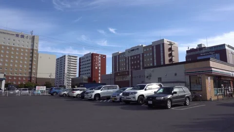 Large Open Parking Space Full of Cars Next To Seven Eleven Convenience Store Stock Footage 268842347