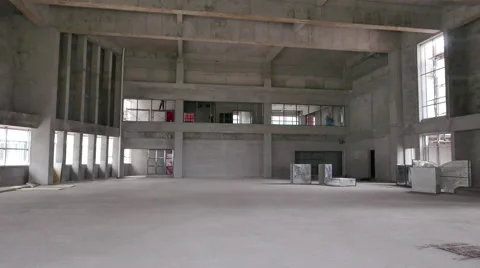 Large Open Room In Construction Site with Workers Walking By - 4K Stock Footage 51253569