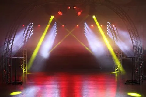 A large, open space with a red and yellow light show Stock Photos