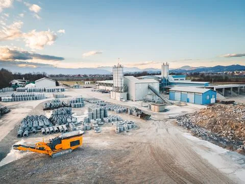 Large open storage site of construction company firm full of construction Stock Photos
