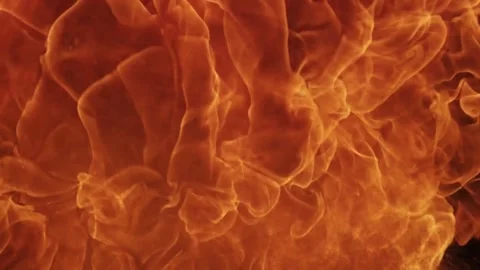 Large orange fireball explosion expanding against a black background Stock Footage 329676243