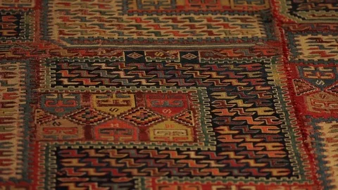 Large oriental carpet with colorful patterns. Handmade carpet production Stock Footage 120314082