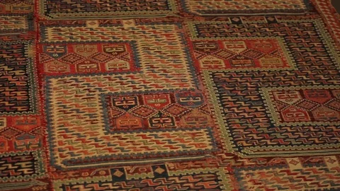 Large oriental carpet with colorful patterns. Handmade carpet production Stock Footage 120314094