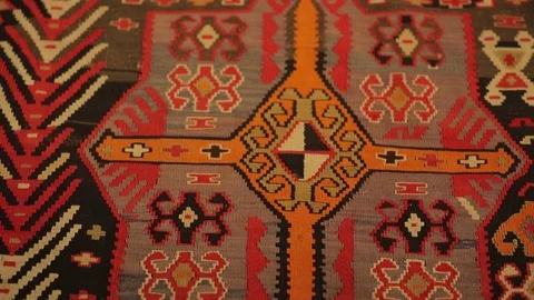Large oriental carpet with colorful patterns. Handmade carpet production Stock Footage 120314103