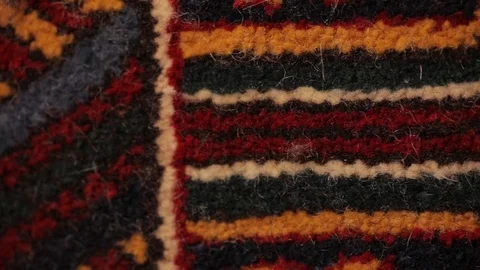 Large oriental carpet with colorful patterns. Handmade carpet production Stock Footage 120314111