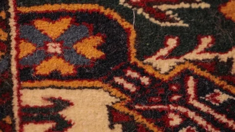 Large oriental carpet with colorful patterns. Handmade carpet production Stock Footage 120609545