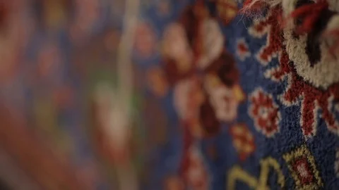 Large oriental carpet with colorful patterns. Handmade carpet production Stock Footage 120609557