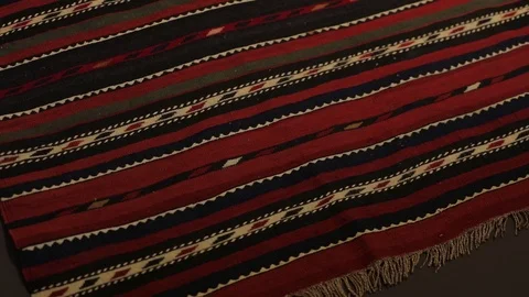 Large oriental carpet with colorful patterns. Handmade carpet production Stock Footage 120609590