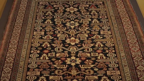Large oriental carpet with colorful patterns. Handmade carpet production Stock Footage 120609637