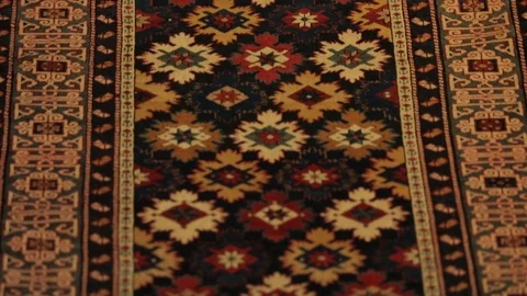 Large oriental carpet with colorful patterns. Handmade carpet production Stock Footage 120609641