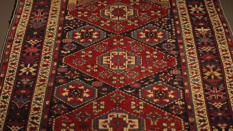 Large oriental carpet with colorful patterns. Handmade carpet production Stock Footage 120609655