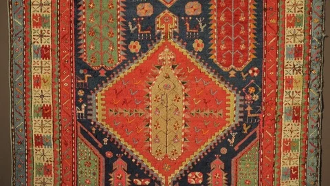 Large oriental carpet with colorful patterns. Handmade carpet production Stock Footage 120609713