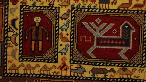 Large oriental carpet with colorful patterns. Handmade carpet production Stock Footage 120609802