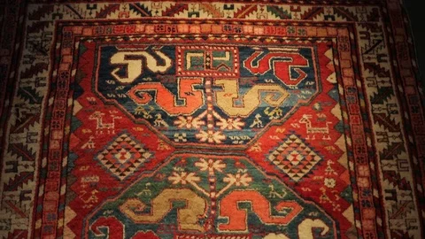 Large oriental carpet with colorful patterns. Handmade carpet production Stock Footage 120609813