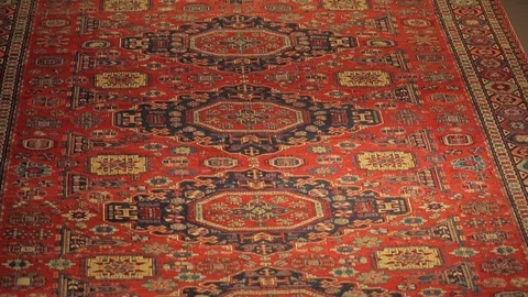 Large oriental carpet with colorful patterns. Handmade carpet production Stock Footage 120609823