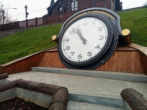 Large outdoor clock installation on hillside Stock Photos