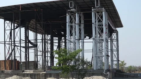 Large outdoor event stage under construction with steel framework Stock Footage 331276980