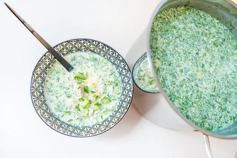 Large pan and one portion of cold summer soup okroshka Stock Photos