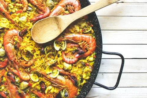 Large pan of rice with seafood paella Stock Photos