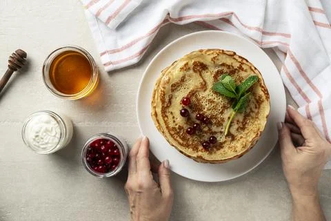 Large pancakes on light stone background Stock-Fotos