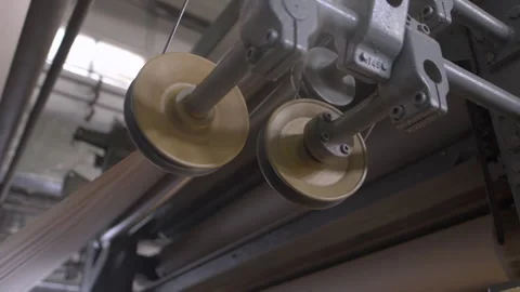 Large paper machine with material tension rollers in workshop Stock Footage 294201064