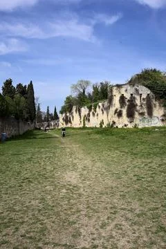 Large passage between boundary walls in a park by the hillside Stock Photos