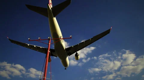 Large Passenger Jet Flying Overhead on Landing Approach Stock Footage 33445993