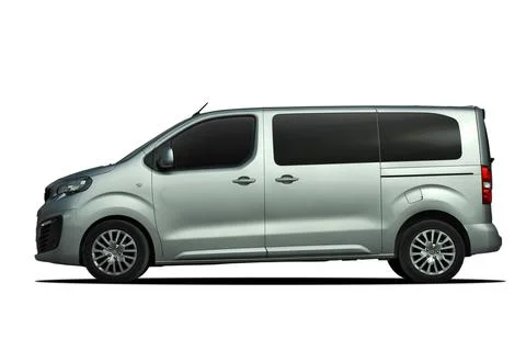 Large passenger van from the side Stock Photos