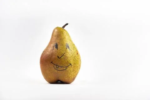 A large pear with a painted smiley face on a white isolated background Stock Photos