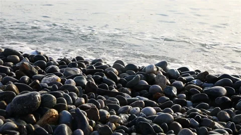 Large pebbles on the beach smooth and clean from the sea waves Stock Footage 132669832
