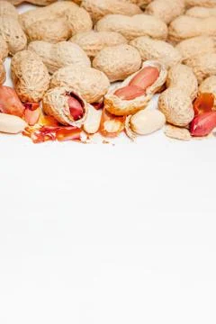 Large peeled peanuts close-up of beans in the shell. Unpeeled peanuts in the  Stock Photos