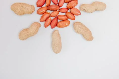 Large peeled peanuts close-up of beans in the shell. Unpeeled peanuts in the  Stock Photos