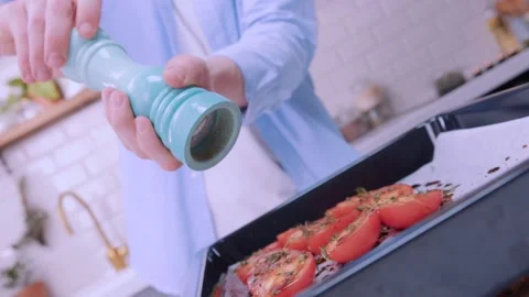 A large pepper shaker in the hands of the chef. Stock Footage 136878607
