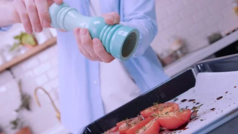 A large pepper shaker in the hands of the chef. Stock Footage 136878620