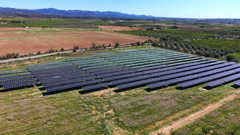 Large photovoltaic panel array in rural Spain surrounded by farmland Stock Footage 332942541