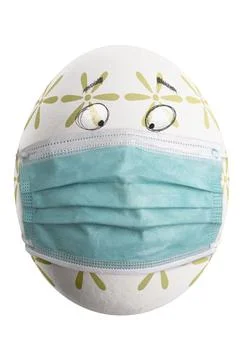 Large picture of an isolated easter egg with floral pattern, eyes and mask. Stock Photos