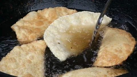 Large pie (Cheburek) fried in oil. Stock Footage 78573671