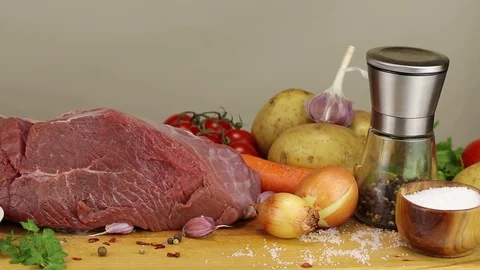 A large piece of beef meat and vegetables Stock Footage 122243531