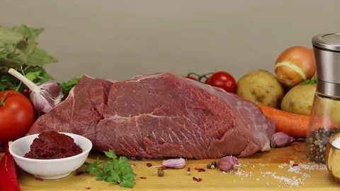 A large piece of beef meat and vegetables Stock Footage 122243536