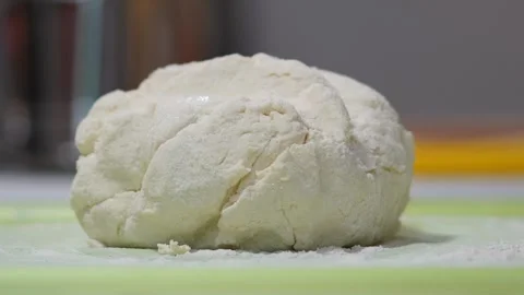 A large piece of dough on the table Stock Footage 318166703