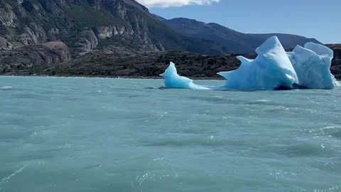 A large piece of ice is floating in the ocean. Stock Footage 271101404