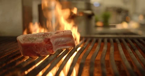 Large Piece of Meat on Kitchen Grill, Cooking Shot Vídeo Stock 127524878