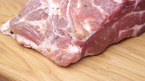 Large piece of meat rotates. raw steak Stock Footage 228846064