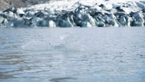 Large piece of melted ice floats in the water. Stock Footage 255057231