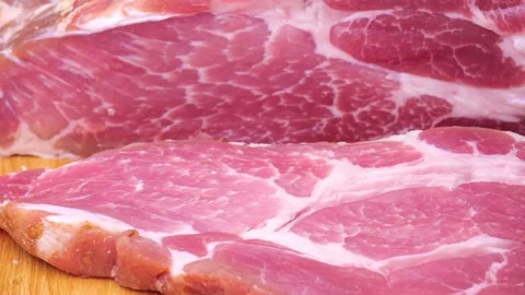 Large piece of raw meat on the table Stock Footage 225937693