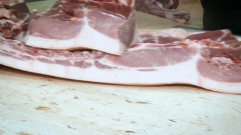 Large pieces of meat. Cutting rides on the conveyor in agribusiness Video stock 102657729