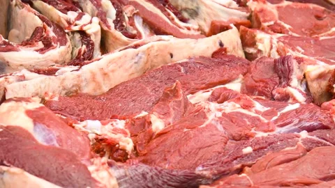 Large pieces of raw meat lying on the counter. Stock-Footage 329868755