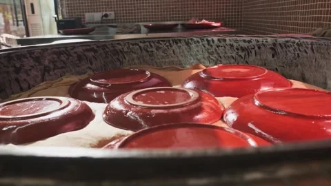 Large pilaf cauldron with steaming rice, covered with cloth and plates Stock Footage 310384506