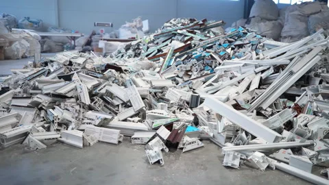 Large pile of broken and discarded PVC profiles with stickers Stock Footage 306667920