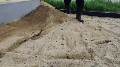 Large pile of construction sand at a building site Vídeos de archivo 346040203